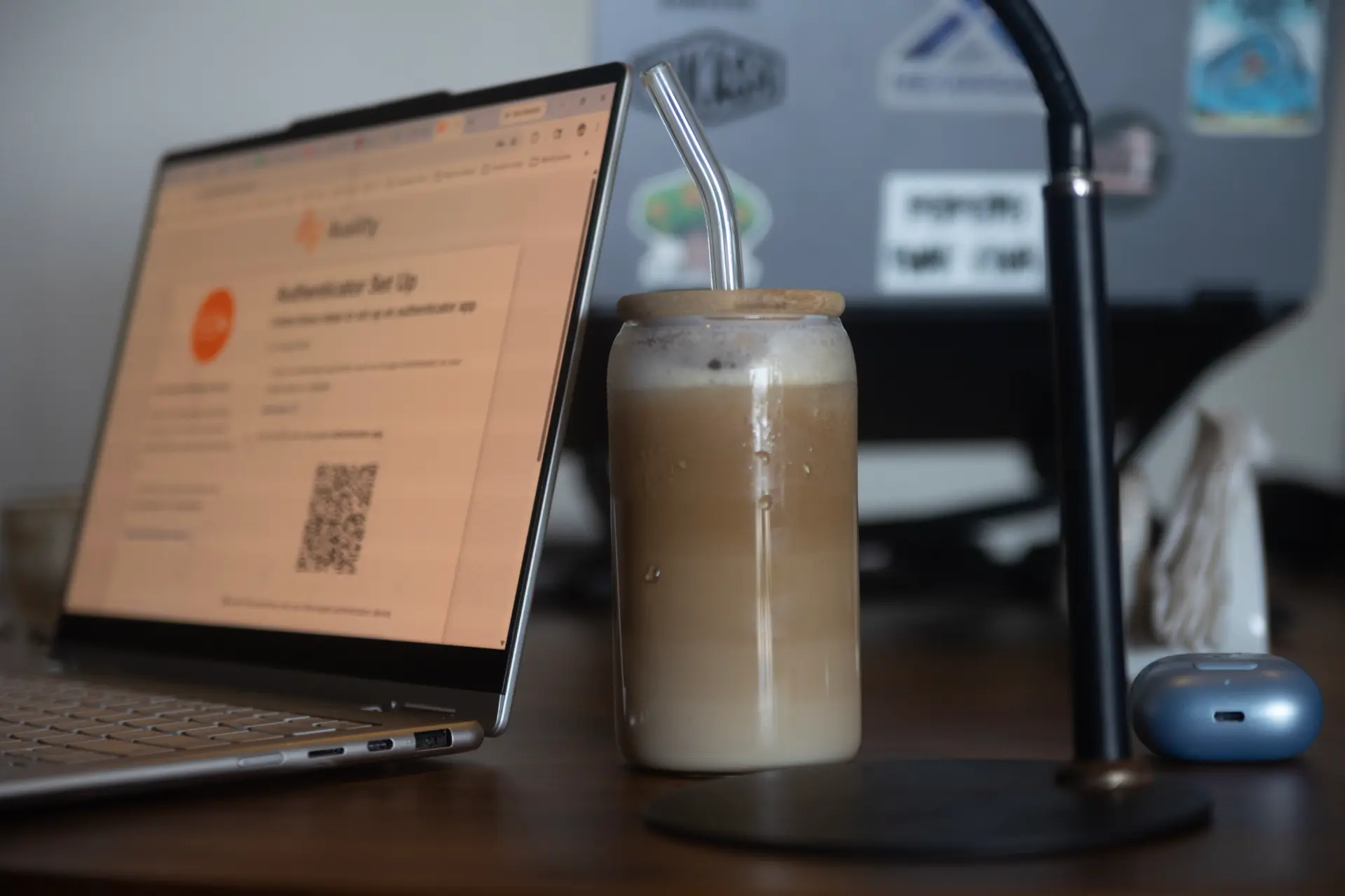 Remote work setup with a laptop and iced latte at The Grind café in the Esc digital nomad village