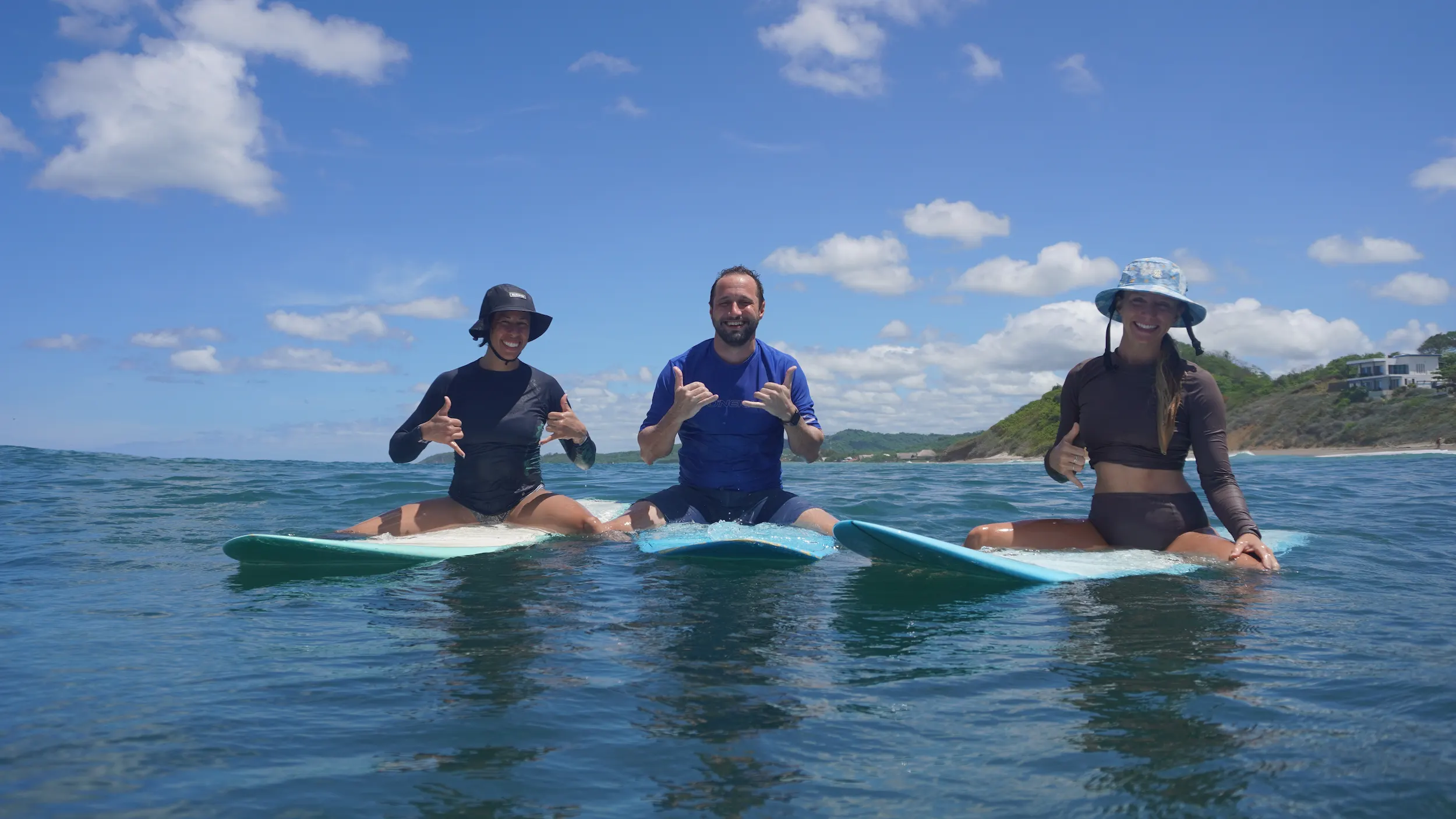 A group of beginners on a surf lesson at Popoyo, a team-building activity for retreats at Esc